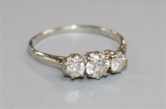 An 18ct white gold and platinum three stone diamond ring, size P.